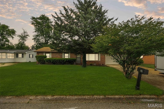 20 Lakeland Blvd, Swansea, IL 62226 - view of front facade featuring a lawn, concrete driveway, and brick siding