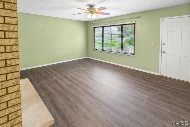 20 Lakeland Blvd, Swansea, IL 62226 - unfurnished living room featuring ceiling fan, dark wood finished floors, and baseboards