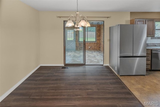 20 Lakeland Blvd, Swansea, IL 62226 - unfurnished dining area featuring a chandelier, plenty of natural light, and baseboards