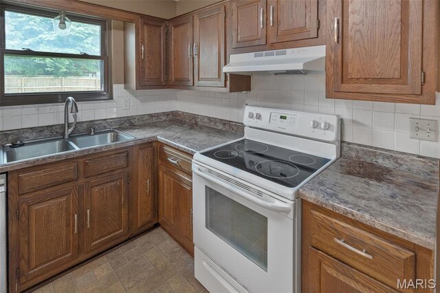 20 Lakeland Blvd, Swansea, IL 62226 - kitchen with white electric range, under cabinet range hood, a sink, and brown cabinets