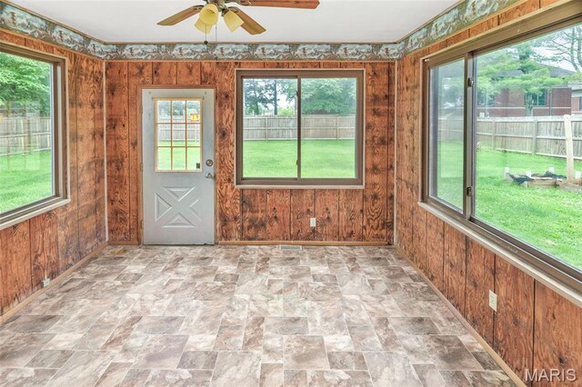 20 Lakeland Blvd, Swansea, IL 62226 - unfurnished sunroom with healthy amount of natural light, wooden walls, and stone finish floors
