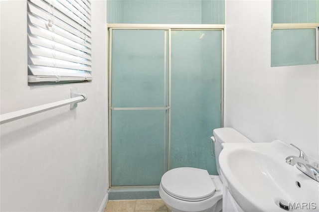 20 Lakeland Blvd, Swansea, IL 62226 - bathroom with toilet, a shower stall, a sink, and baseboards