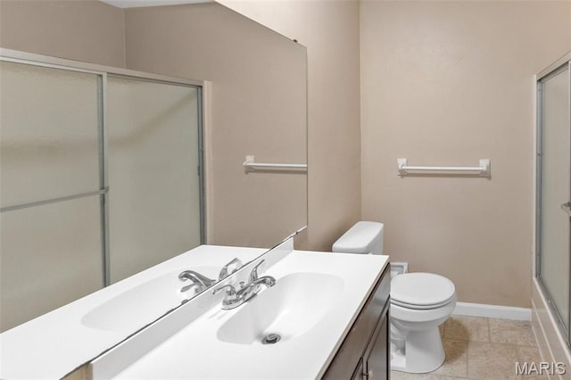20 Lakeland Blvd, Swansea, IL 62226 - full bath featuring toilet, a shower with shower door, vanity, tile patterned floors, and baseboards
