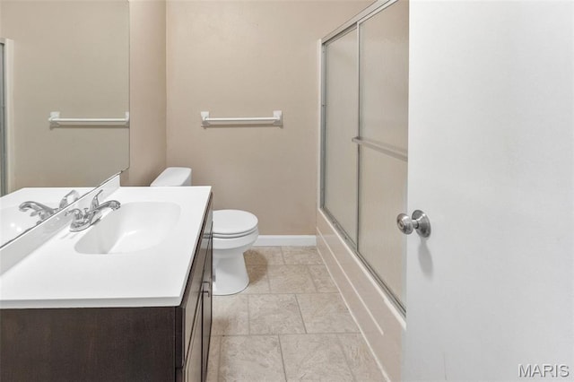 20 Lakeland Blvd, Swansea, IL 62226 - full bathroom featuring toilet, vanity, baseboards, and bath / shower combo with glass door