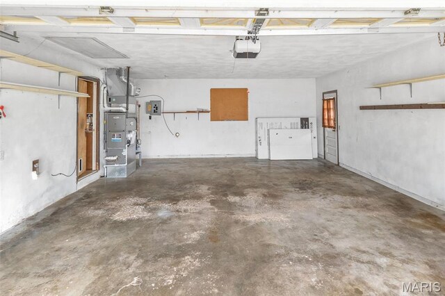 20 Lakeland Blvd, Swansea, IL 62226 - garage with a garage door opener, heating unit, and electric panel