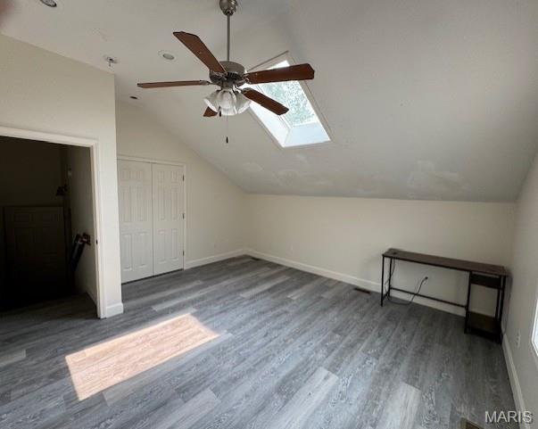 1804 N Oak St, Rolla, MO 65401 - bonus room featuring vaulted ceiling, baseboards, a skylight, wood finished floors, and ceiling fan
