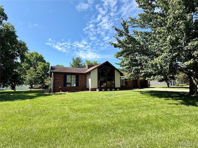 112 Cross Creek Dr, Bethalto, IL 62010 - view of front of house with a front lawn and a chimney