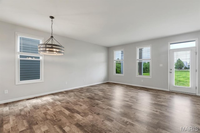 109 Starry Night Way, Saint Charles, MO 63301 - unfurnished room with a chandelier and wood finished floors