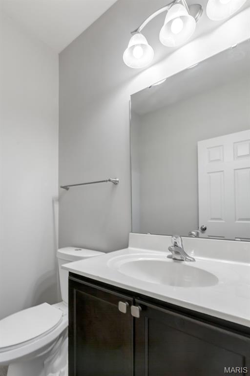 109 Starry Night Way, Saint Charles, MO 63301 - bathroom featuring vanity and toilet