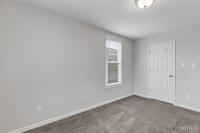 109 Starry Night Way, Saint Charles, MO 63301 - spare room with baseboards and dark colored carpet