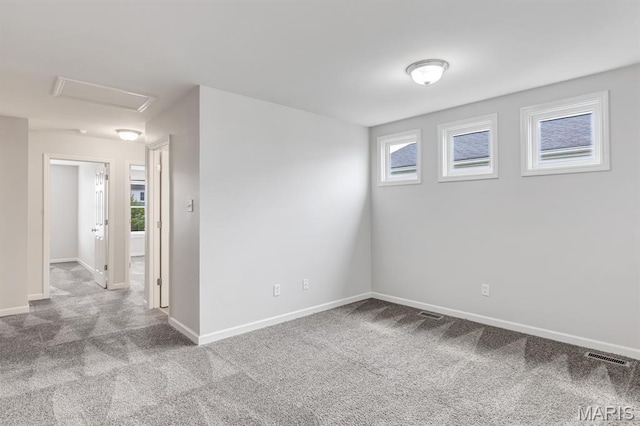 109 Starry Night Way, Saint Charles, MO 63301 - empty room with carpet floors and attic access