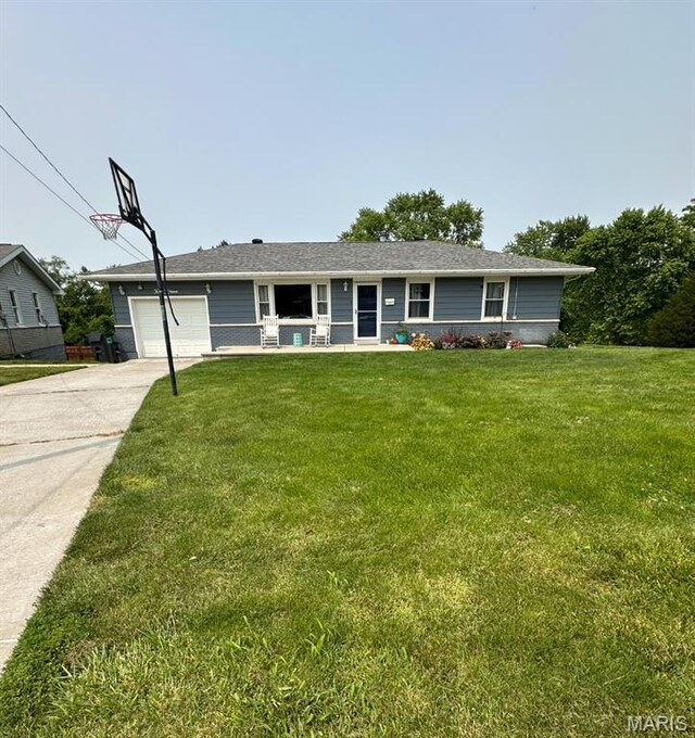 415 Virginia Ave, Cottage Hills, IL 62018 - ranch-style house with a front lawn, driveway, and a garage
