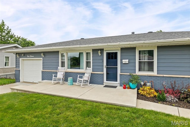 415 Virginia Ave, Cottage Hills, IL 62018 - rear view of house featuring brick siding, a garage, and a lawn