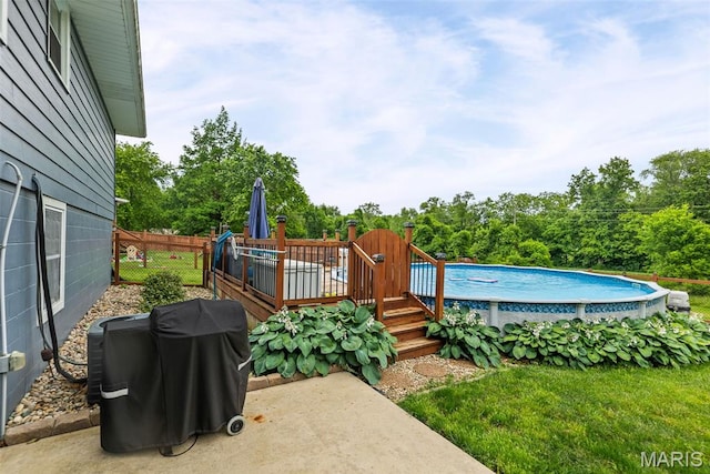 415 Virginia Ave, Cottage Hills, IL 62018 - outdoor pool with a deck and view of wooded area