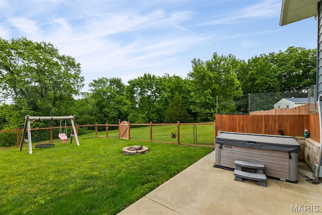 415 Virginia Ave, Cottage Hills, IL 62018 - view of yard featuring a hot tub, a fire pit, and a patio area
