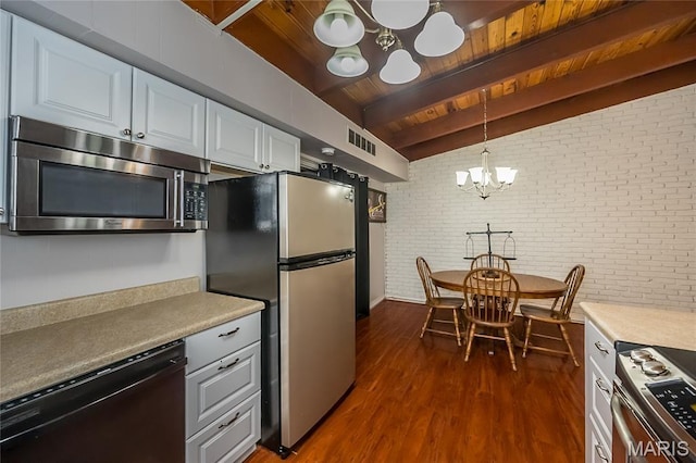 110 Coral Ter Unit 13, Ballwin, MO 63011 - kitchen with a chandelier, appliances with stainless steel finishes, brick wall, dark wood finished floors, and wood ceiling