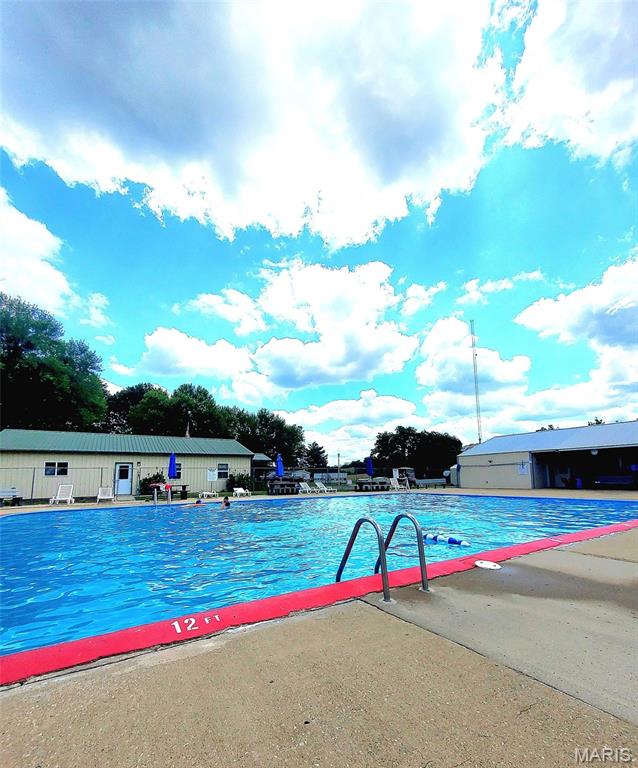 303 Arrowhead Trl, Hermann, MO 65041 - community pool featuring a patio
