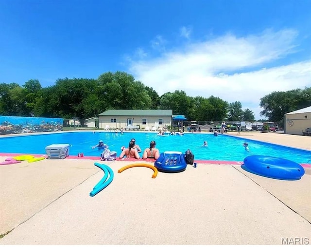303 Arrowhead Trl, Hermann, MO 65041 - community pool featuring a patio area