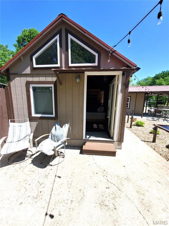 303 Arrowhead Trl, Hermann, MO 65041 - rear view of house featuring a patio area