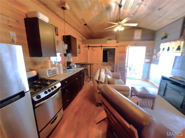 303 Arrowhead Trl, Hermann, MO 65041 - kitchen featuring appliances with stainless steel finishes, vaulted ceiling, a ceiling fan, light wood finished floors, and wood ceiling