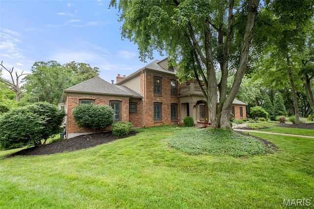 9 Arlington Oaks Ct, Town And Country, MO 63017 - view of front of home featuring a balcony, a front yard, brick siding, and roof with shingles