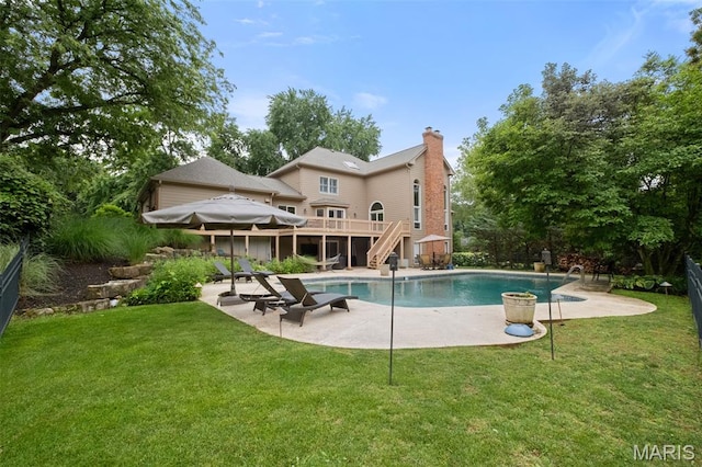 9 Arlington Oaks Ct, Town And Country, MO 63017 - swimming pool with stairs, a patio, a yard, and a wooden deck