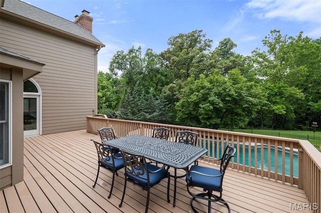 9 Arlington Oaks Ct, Town And Country, MO 63017 - wooden deck with outdoor dining space and view of wooded area