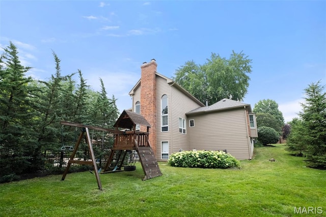 9 Arlington Oaks Ct, Town And Country, MO 63017 - rear view of house with a chimney, a lawn, and a playground