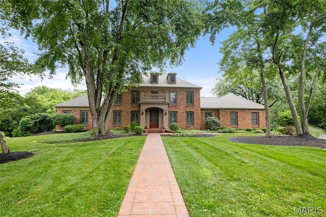 9 Arlington Oaks Ct, Town And Country, MO 63017 - georgian-style home featuring brick siding, a front lawn, and a balcony