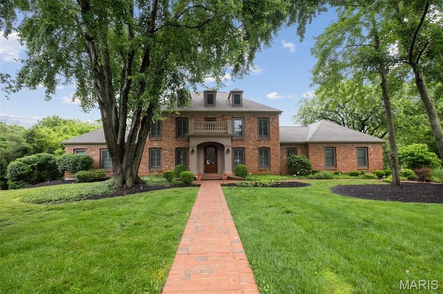 9 Arlington Oaks Ct, Town And Country, MO 63017 - colonial house featuring brick siding and a front lawn