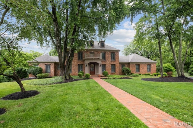9 Arlington Oaks Ct, Town And Country, MO 63017 - georgian-style home with brick siding, a balcony, and a front lawn