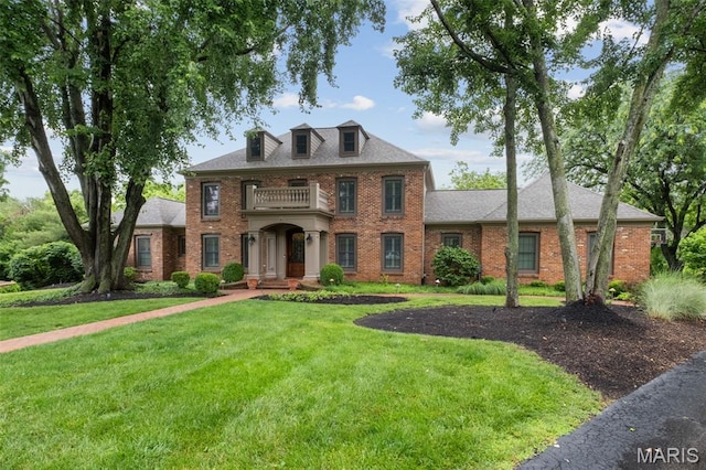 9 Arlington Oaks Ct, Town And Country, MO 63017 - colonial home featuring a balcony, brick siding, and a front lawn