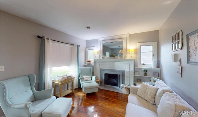 604 N Hena St, Greenville, IL 62246 - living area with a fireplace with flush hearth and wood finished floors