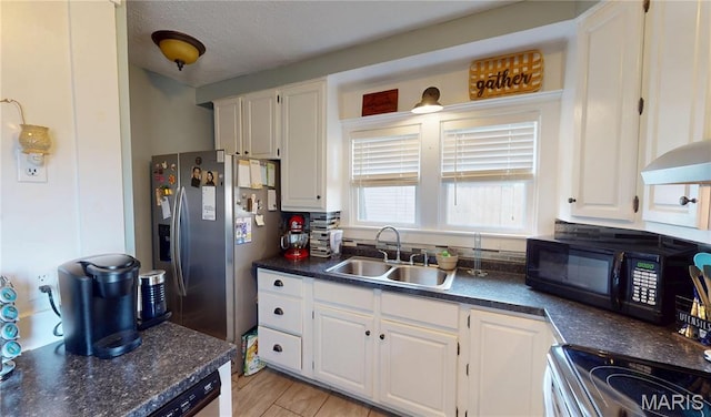 604 N Hena St, Greenville, IL 62246 - kitchen featuring a sink, black microwave, dark countertops, white cabinets, and a textured ceiling