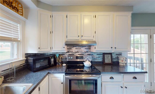 604 N Hena St, Greenville, IL 62246 - kitchen featuring electric stove, under cabinet range hood, white cabinetry, and dark countertops