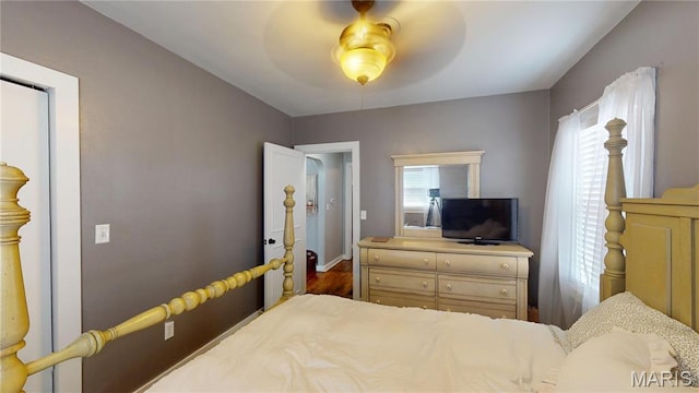 604 N Hena St, Greenville, IL 62246 - bedroom with baseboards, ceiling fan, and wood finished floors