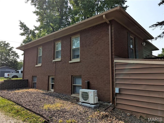 604 N Hena St, Greenville, IL 62246 - view of side of property featuring a cooling unit and brick siding