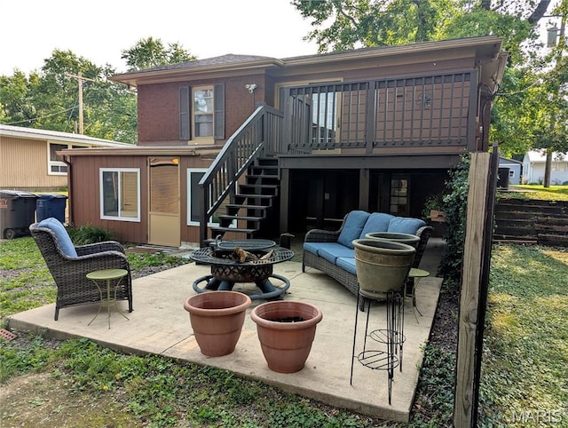 604 N Hena St, Greenville, IL 62246 - back of house with stairway, a wooden deck, a patio, and an outdoor living space with a fire pit