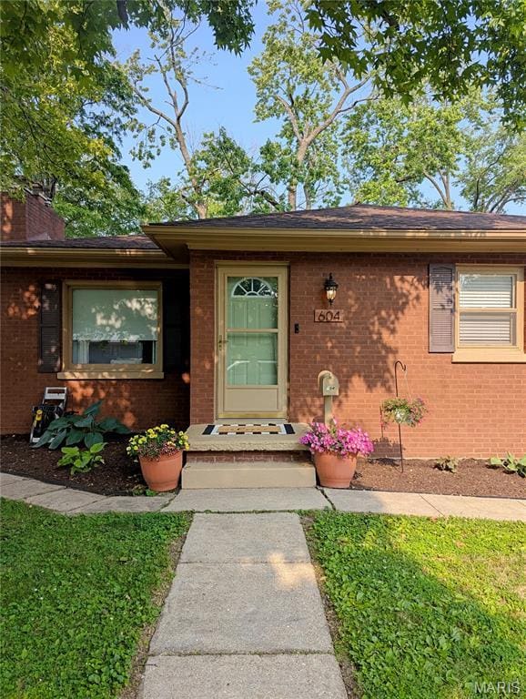 604 N Hena St, Greenville, IL 62246 - property entrance with brick siding and a chimney