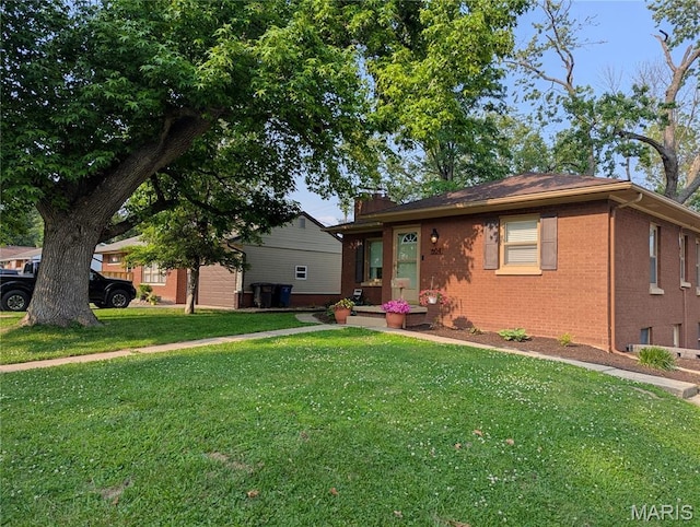 604 N Hena St, Greenville, IL 62246 - view of front of house featuring brick siding and a front yard
