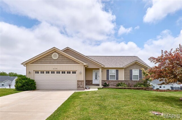628 Meadowgreen Dr, Troy, MO 63379 - single story home featuring concrete driveway, a front lawn, a garage, and board and batten siding