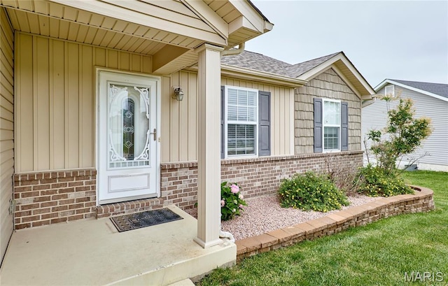 628 Meadowgreen Dr, Troy, MO 63379 - view of exterior entry featuring brick siding, board and batten siding, and a shingled roof
