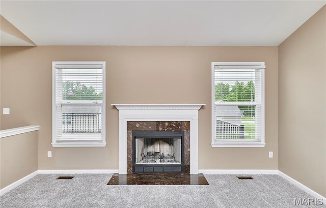 628 Meadowgreen Dr, Troy, MO 63379 - unfurnished living room with carpet flooring, a high end fireplace, and plenty of natural light