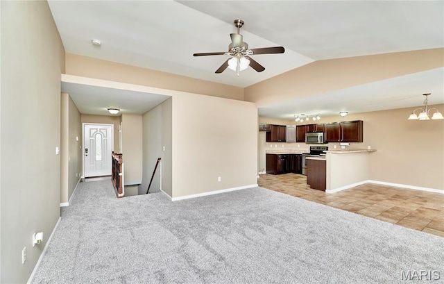628 Meadowgreen Dr, Troy, MO 63379 - unfurnished living room featuring a ceiling fan, a chandelier, light carpet, and lofted ceiling