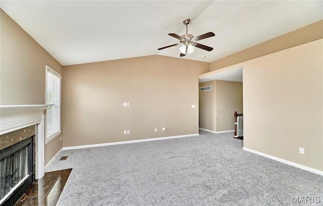 628 Meadowgreen Dr, Troy, MO 63379 - unfurnished living room featuring ceiling fan, vaulted ceiling, carpet flooring, and a premium fireplace