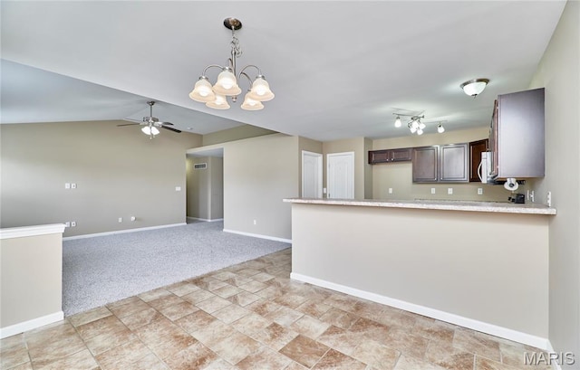 628 Meadowgreen Dr, Troy, MO 63379 - kitchen featuring light countertops, a chandelier, dark brown cabinets, ceiling fan, and a peninsula