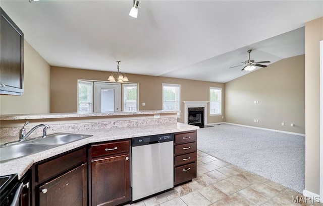 628 Meadowgreen Dr, Troy, MO 63379 - kitchen with appliances with stainless steel finishes, light carpet, light countertops, a peninsula, and a fireplace