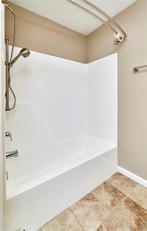 628 Meadowgreen Dr, Troy, MO 63379 - bathroom with tub / shower combination and tile patterned floors