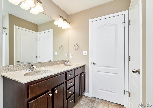 628 Meadowgreen Dr, Troy, MO 63379 - bathroom featuring double vanity and baseboards