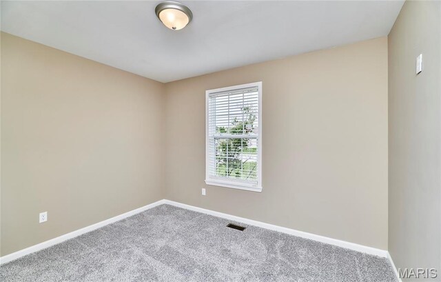 628 Meadowgreen Dr, Troy, MO 63379 - spare room featuring carpet and baseboards
